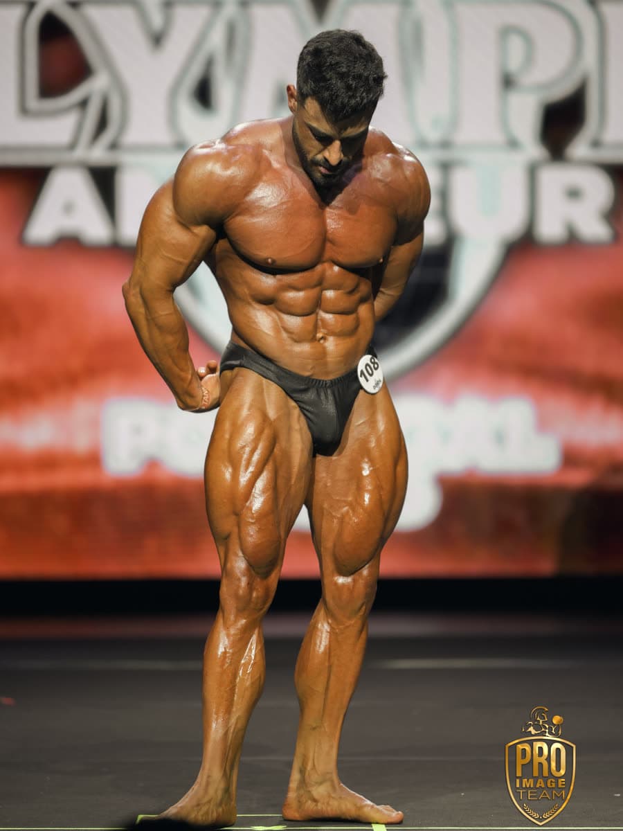 Diego posing on the Olympia Amateur stage