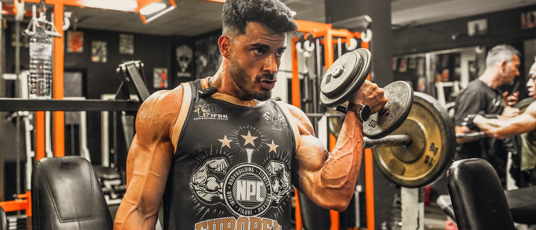 Diego training in the gym wearing an NPC European Championship vest